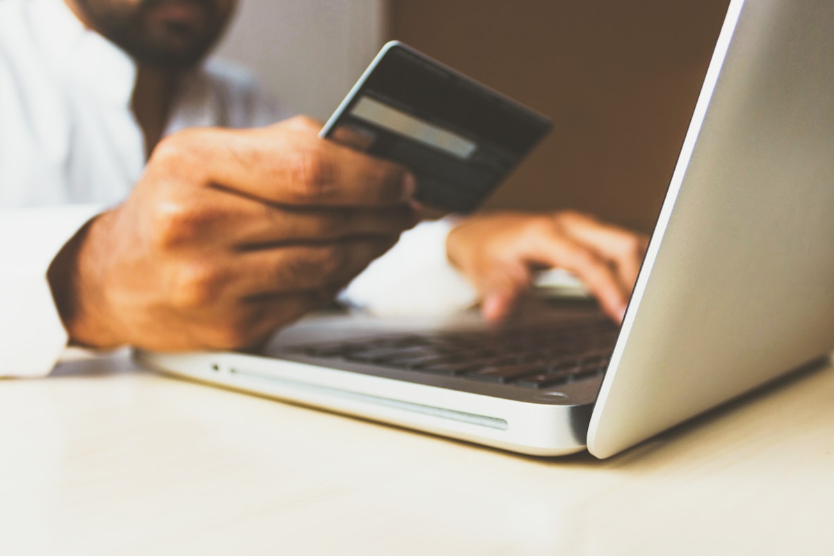 Customer making a secure payment with a debit card at a payment terminal
